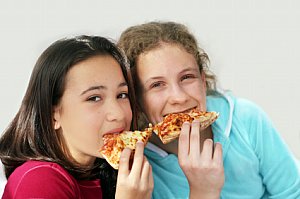 eating pizza A kids homemade pizza party is fun for all ages