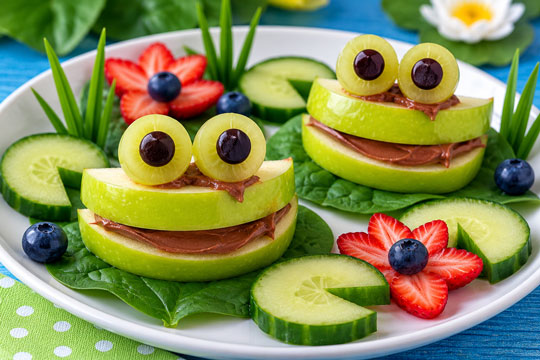 Apple frog snack arranged with edible lily pads