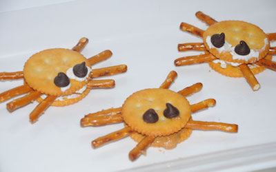kids cooking lessons on practice spreading with a knife and creating spider crackers