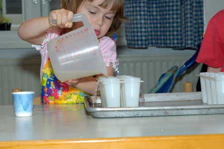 kids cooking lessons pouring popscicles