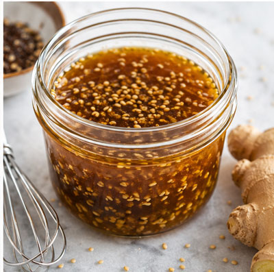 Homemade sesame ginger salad dressing in a glass jar
