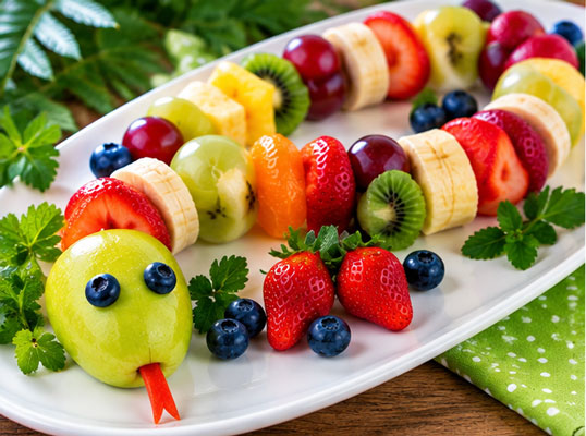 Snake shape made with colorful pieces of fruit