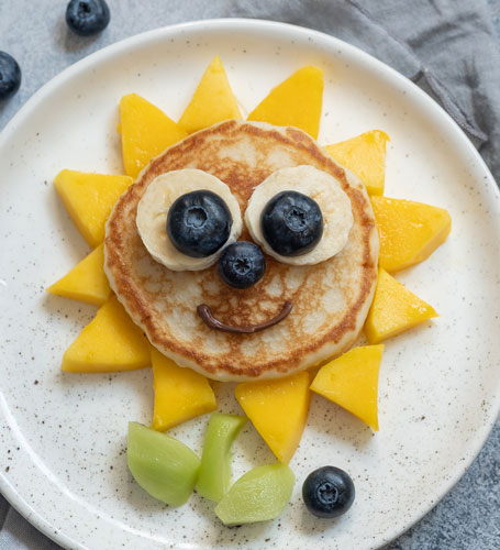 sunflower made fruit and pancakes