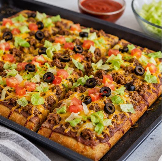Homemade taco pizza with cheese and taco toppings