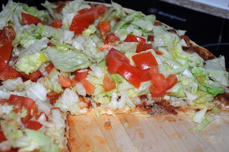 taco pizza sliced