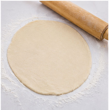 Rolling homemade flour tortillas