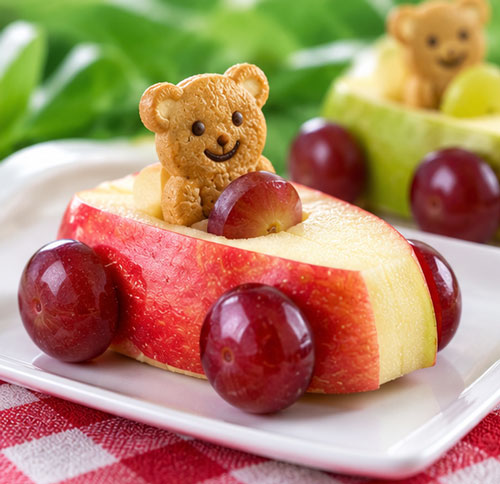 Apple cars with grape wheels and teddy bear graham cracker drivers