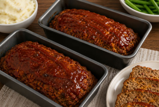 Bacon cheeseburger meatloaf sliced and ready to serve