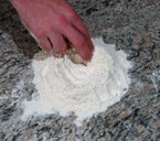 mixing homemade pasta dough by hand