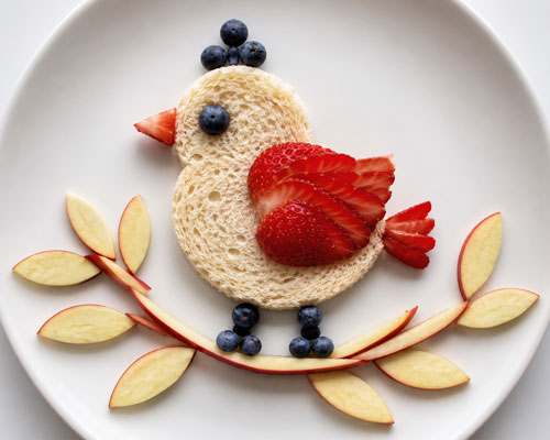 Bird snack made from fruit and bread