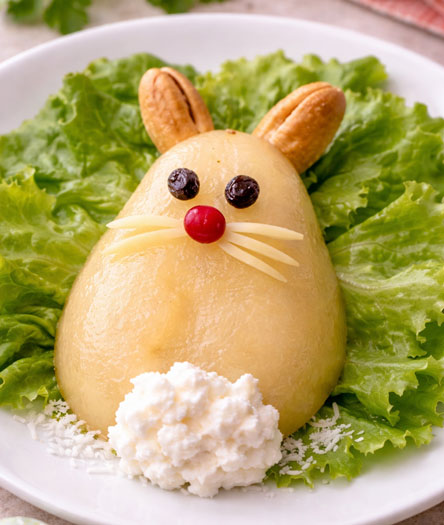 pear half decorated as a bunny with raisins for eyes and cottage cheese tail-chgt/kca