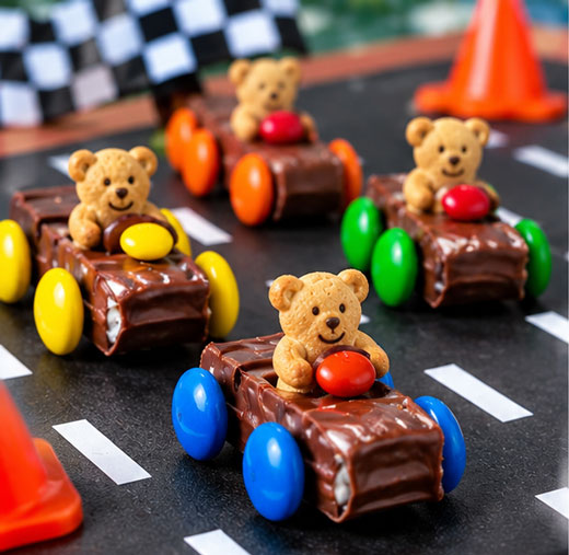Candy race car with a teddy bear cracker driver