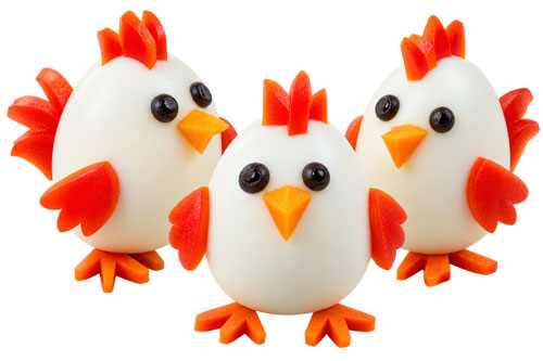 Hard boiled eggs decorated to look like chickens
