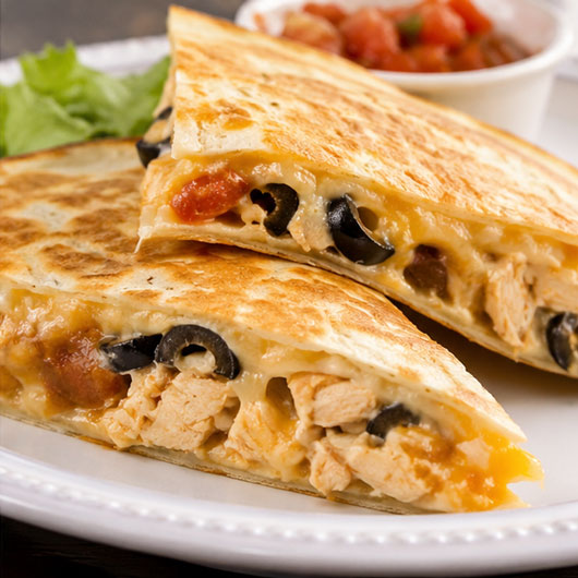 Cheesy chicken quesadilla with salsa