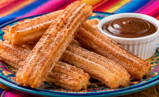 Homemade churros sprinkled with sugar