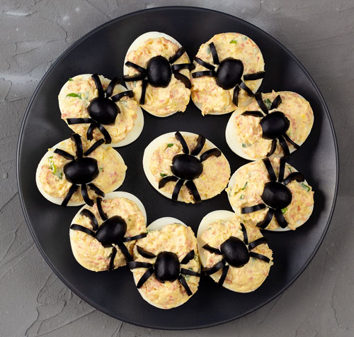 deviled eggs with olive spiders
