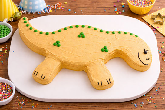 Dinosaur shaped birthday cake for kids