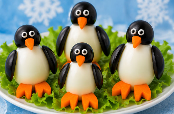Penguins made with hard-boiled eggs, olives and carrots