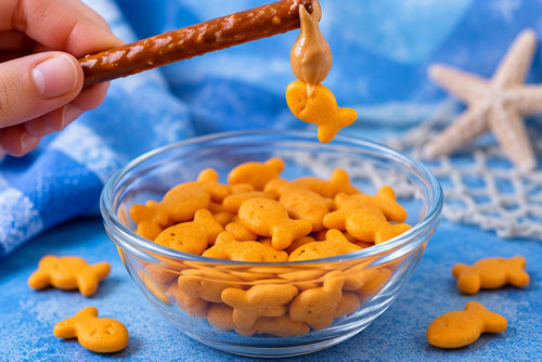 Pretzel and breadstick fishing snack with fish crackers