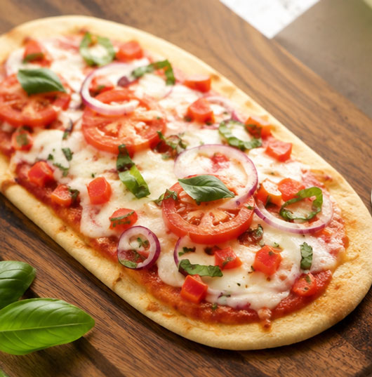 Flatbread pizza with vegetables and cheese