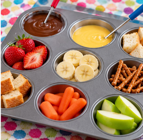 Individual fondue tray made with a muffin tin and assorted dipping foods