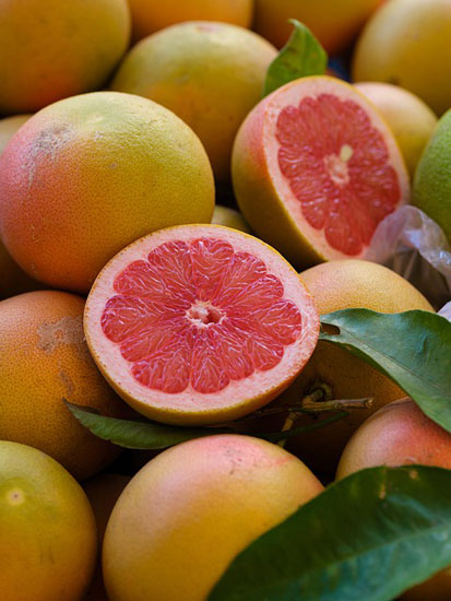 grapefruit cut in half and whole