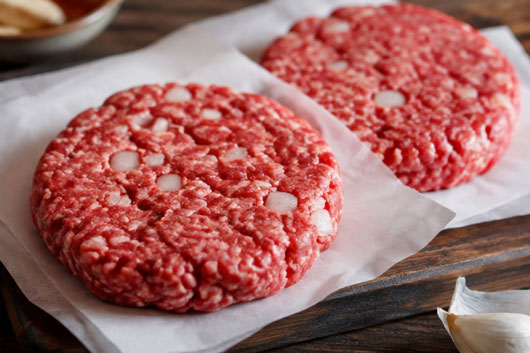 Homemade hamburger patties being shaped