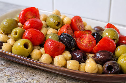 Olive salad with garbanzo beans and tomatoes