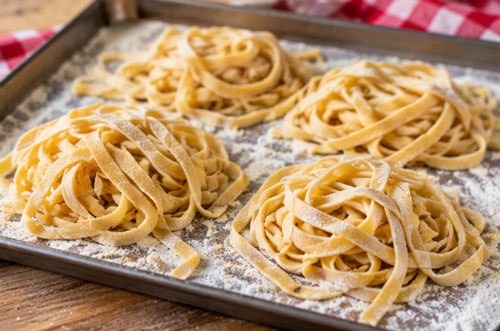 Fresh homemade pasta noodles drying