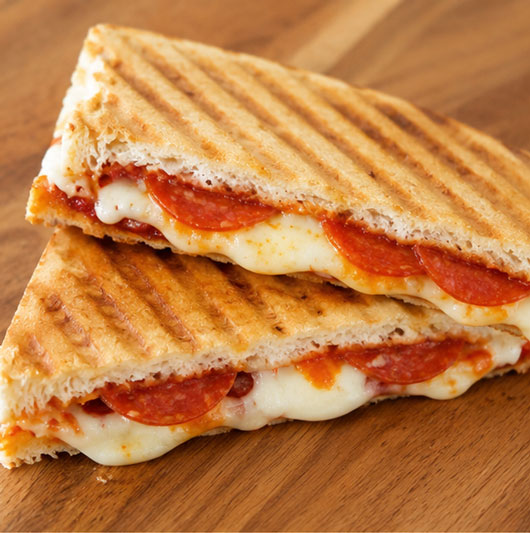 Pizza panini with sauce cheese and pizza toppings