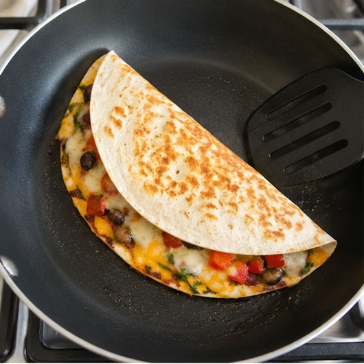 Cooking a quesadilla in a skillet