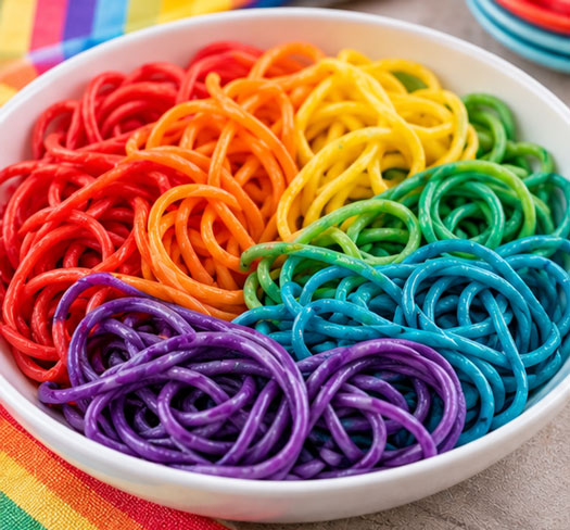 Spaghetti noodles colored in several rainbow colors