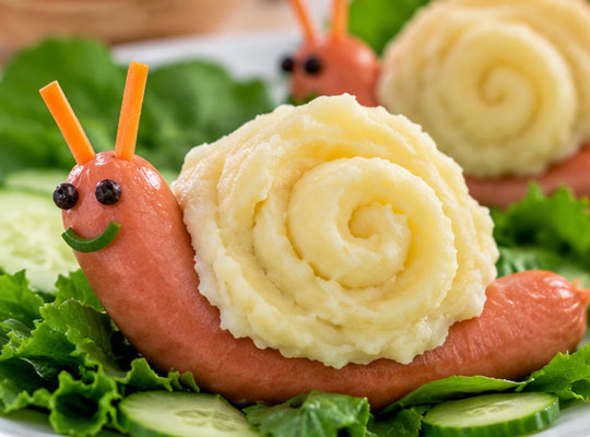 Snail made with mashed potatoes and a chicken strip