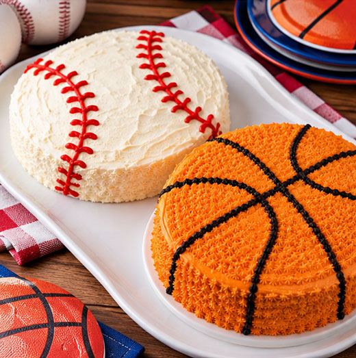 Homemade baseball and basketball cakes for a sports party
