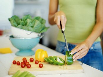 chopping vegetables in kitchen