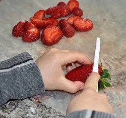 kids chopping strawberries