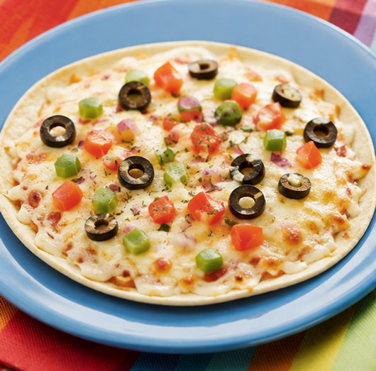 Skillet tortilla pizza with cheese and toppings