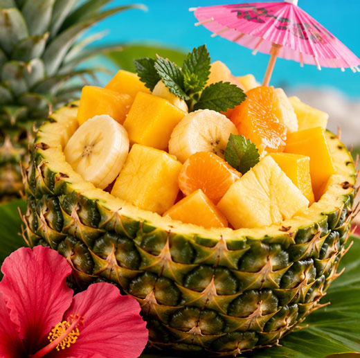 Tropical fruit salad with mango pineapple banana and orange