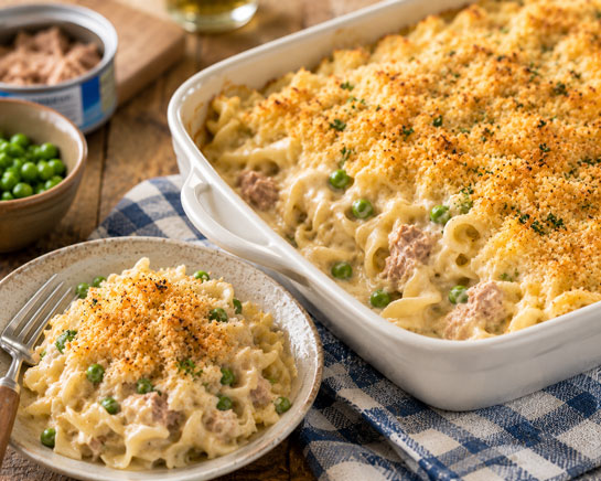 Classic creamy tuna noodle casserole with peas and a golden breadcrumb topping