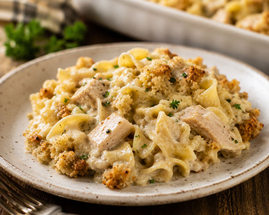 Creamy turkey noodle casserole with stuffing topping