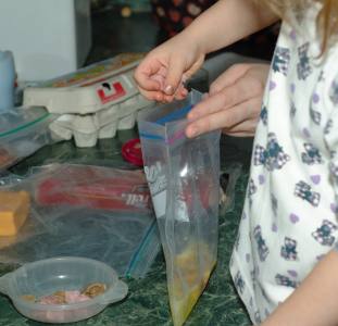 adding ingredients to a baggie omelet