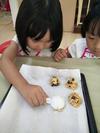 Dropping spoonful cookies mixture on the tray